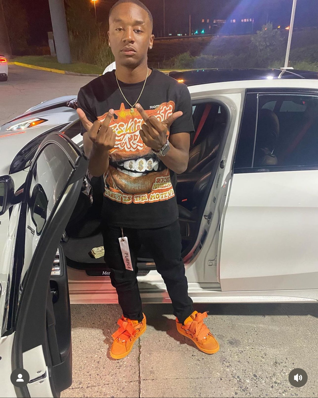 Money is the motive tee black orange